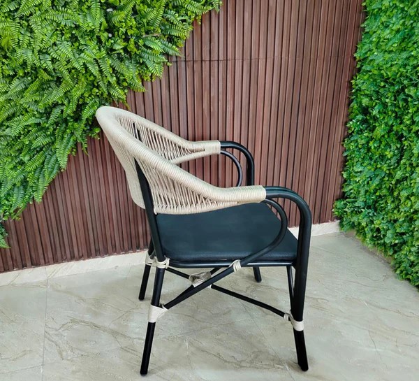 Luxury metal chair woven with ropes and featuring an imported mesh base.2